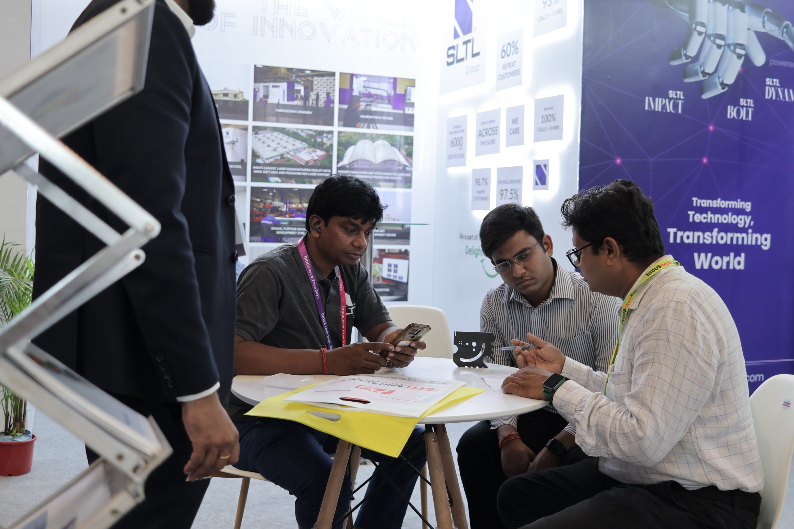 Two professionals in one-on-one business discussion at expo