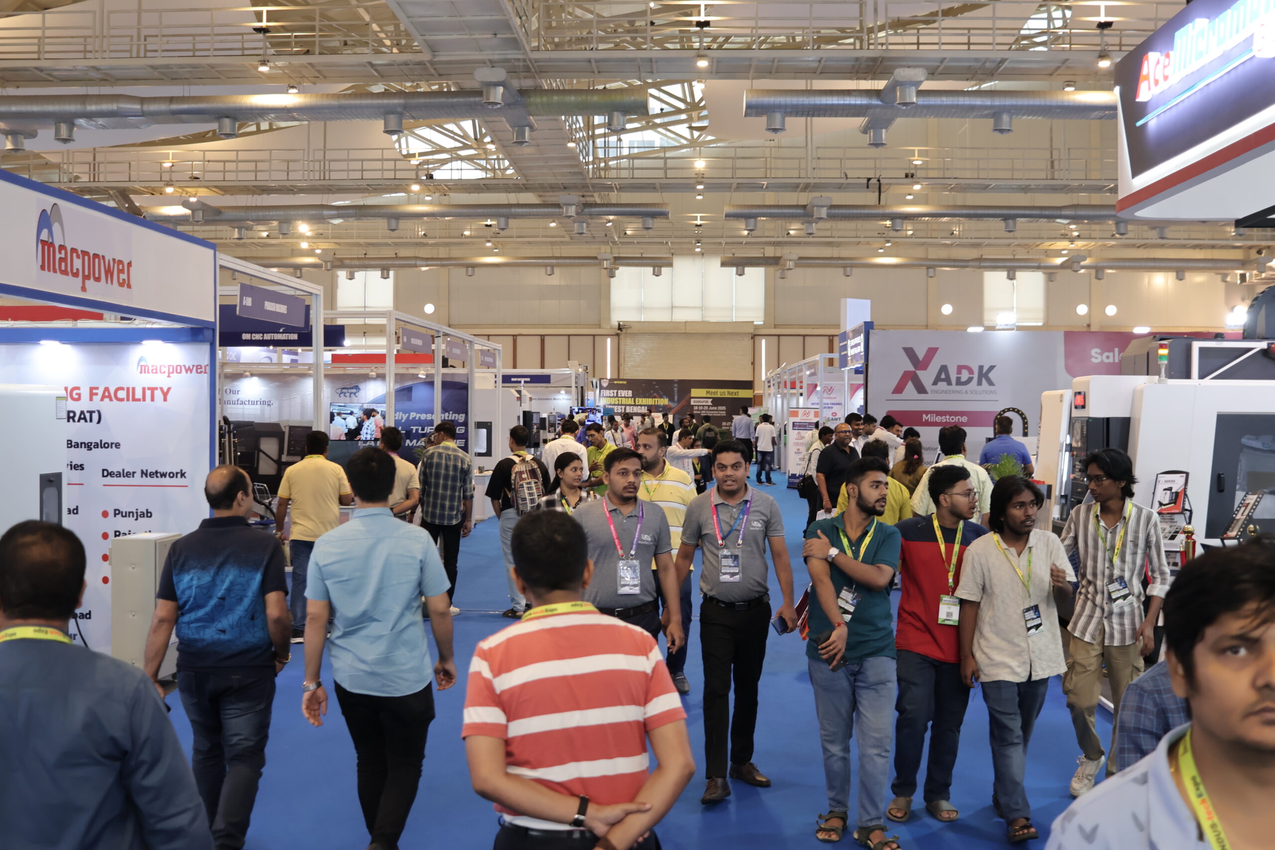 Wide exhibition hall Kolkata with Macpower ADK stalls large crowd