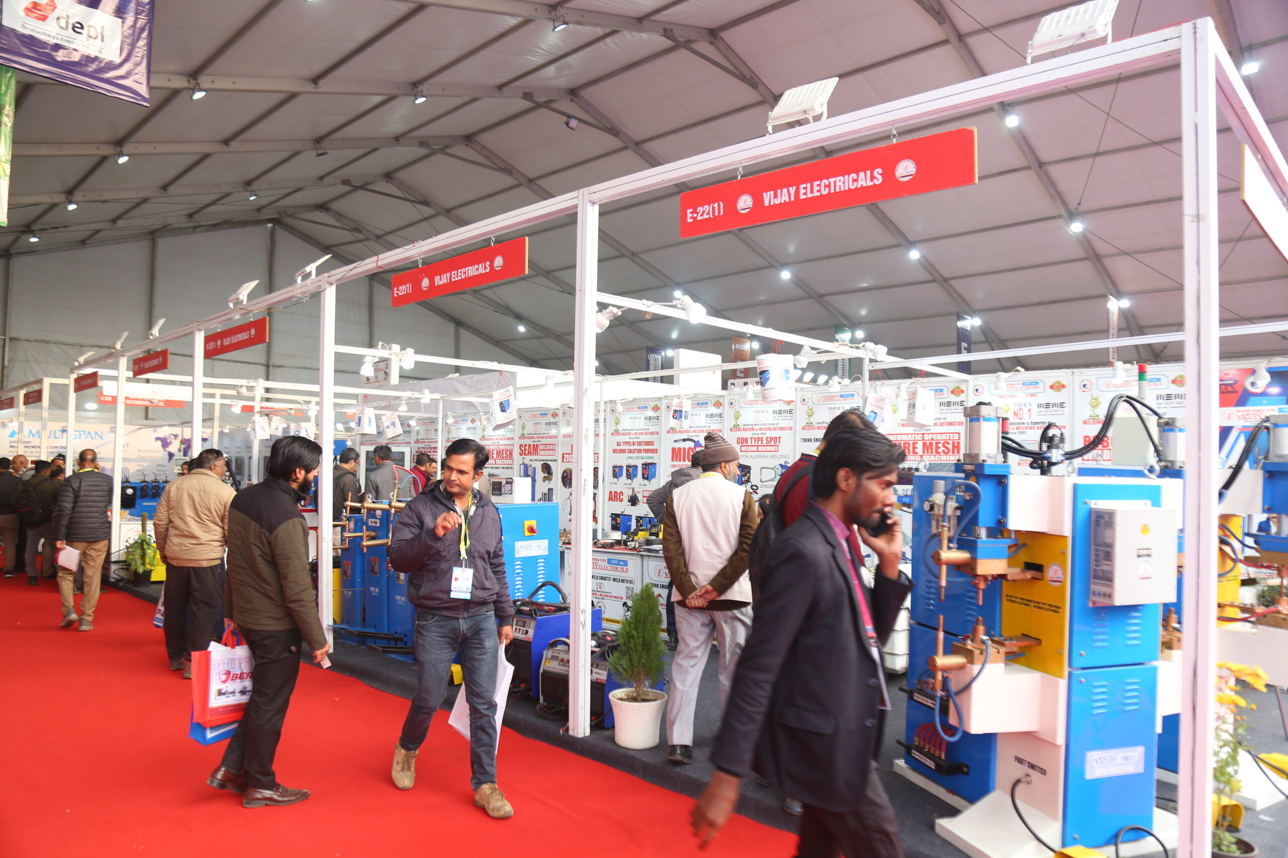 Vijay Electricals welding machine stall visitors on exhibition floor