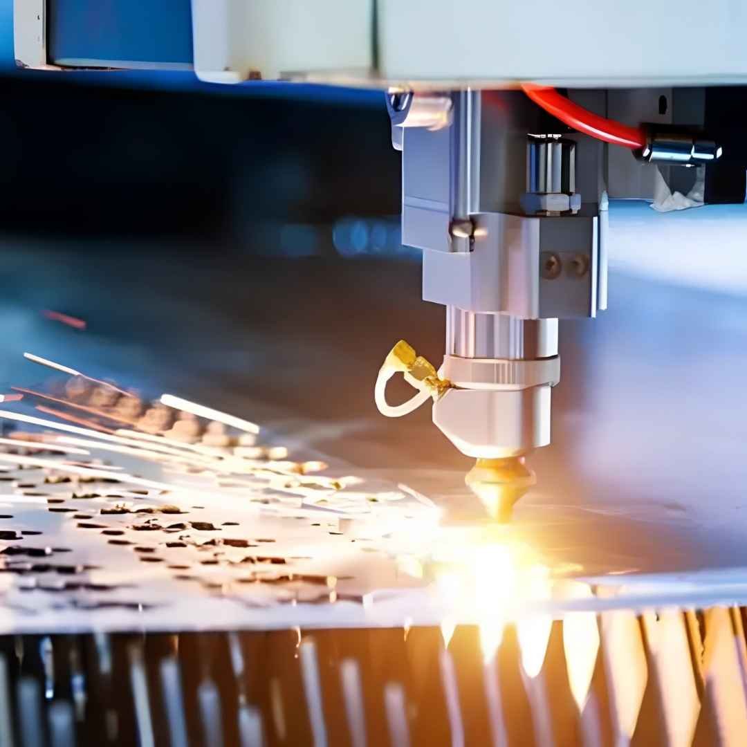 Laser and metal cutting machine cutting a steel sheet
